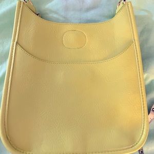 Cute bag without the strap. It’s Ahdorned brand.